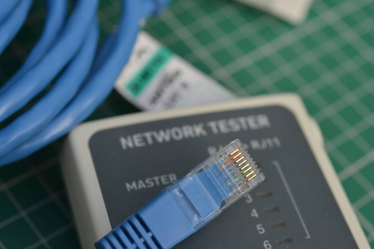 Engineer using system testing tools to simulate network partition in distributed database